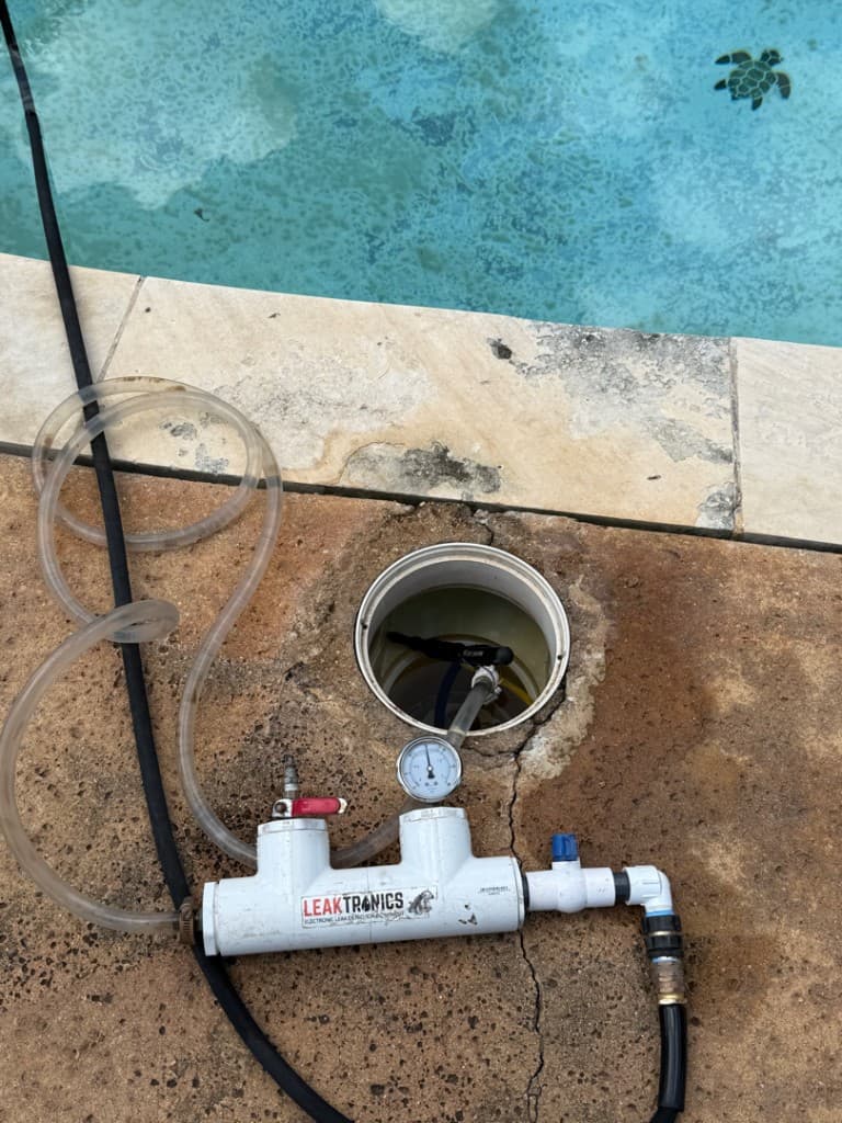 Structural crack running from fitting down pool wall — Spicewood