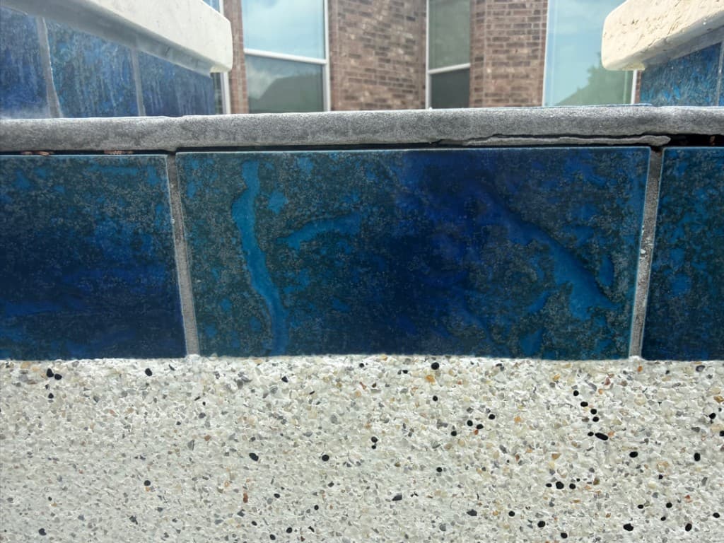 Diver performing underwater pool leak inspection in Central Texas