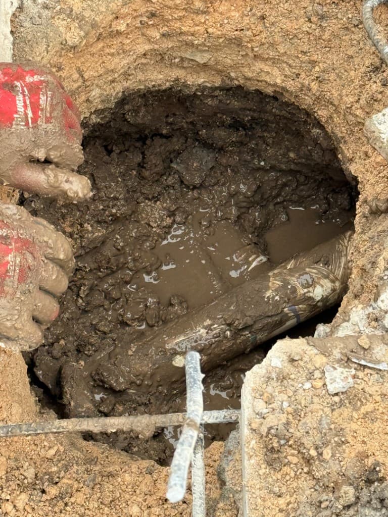 Diver performing underwater pool leak inspection in Central Texas